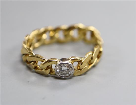 An 18ct gold curblink and diamond set ring, size size N.